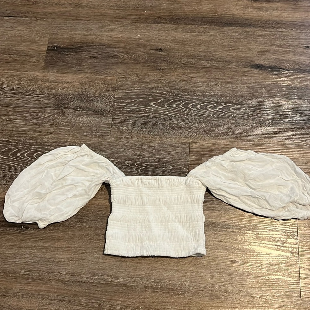 White crop top. Stretchy material. Looks small in picture